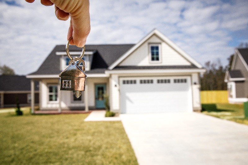 New keys in front of a new home